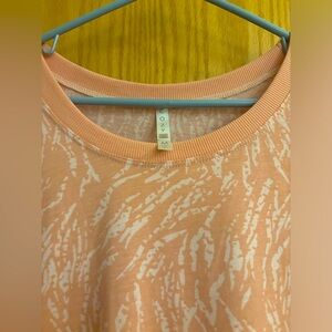 Pink colored with cream colored animal type print top. Size Medium LuLaRoe